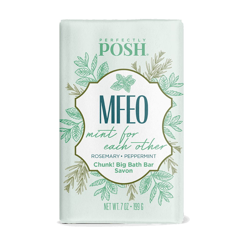 Enjoy a 7 oz MFEO Mint for Each Other Chunk Big Bath Bar by Perfectly Posh. This nourishing soap blends rosemary, peppermint, and shea butter in light green packaging with botanical designs and gold accents.