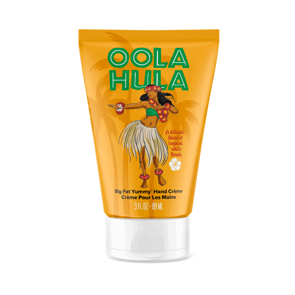 A yellow tube of Perfectly Posh Oola Hula Big Fat Yummy Hand Cream, 3 fl oz/89 mL, features a hula dancer and lush palm trees on the label.
