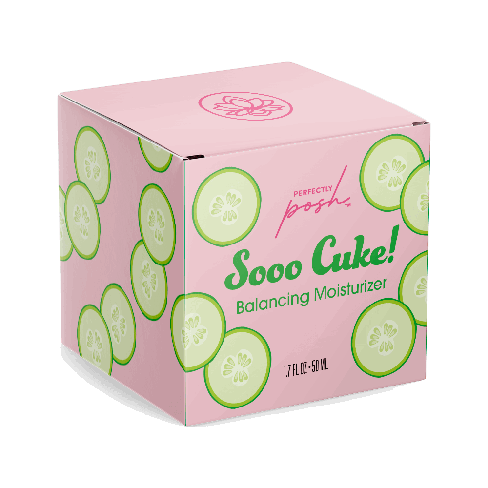 A pink box with green cucumber slices and a floral logo displays Sooo Cuke! Balancing Moisturizer by Perfectly Posh, 1.7 fl oz (50 mL)—a lightweight daily moisturizer, ideal for combination or sensitive skin.