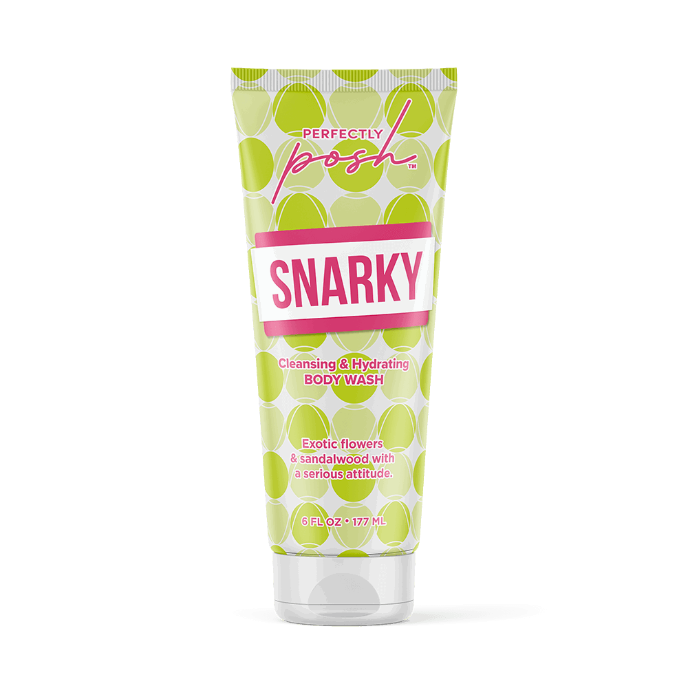 A tube of Perfectly Posh Snarky Cleansing & Hydrating Body Wash with a green polka dot design and pink label, featuring exotic flower and sandalwood scent with soothing aloe for cleansing and hydration.