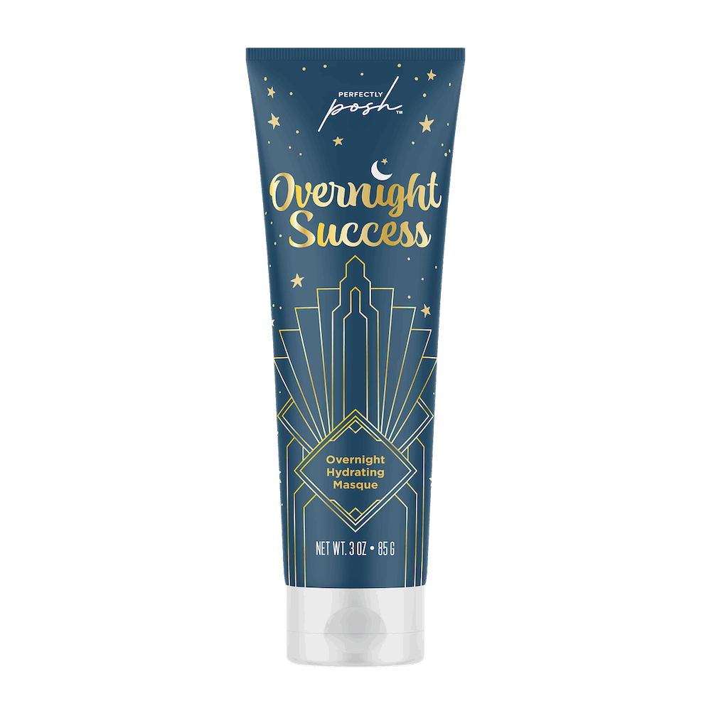 A blue and gold tube labeled Perfectly Posh Overnight Success Mask features a city skyline, stars, and crescent moon. This 3 oz (85 g) overnight hydrating mask with vitamin C is from Perfectly Posh.