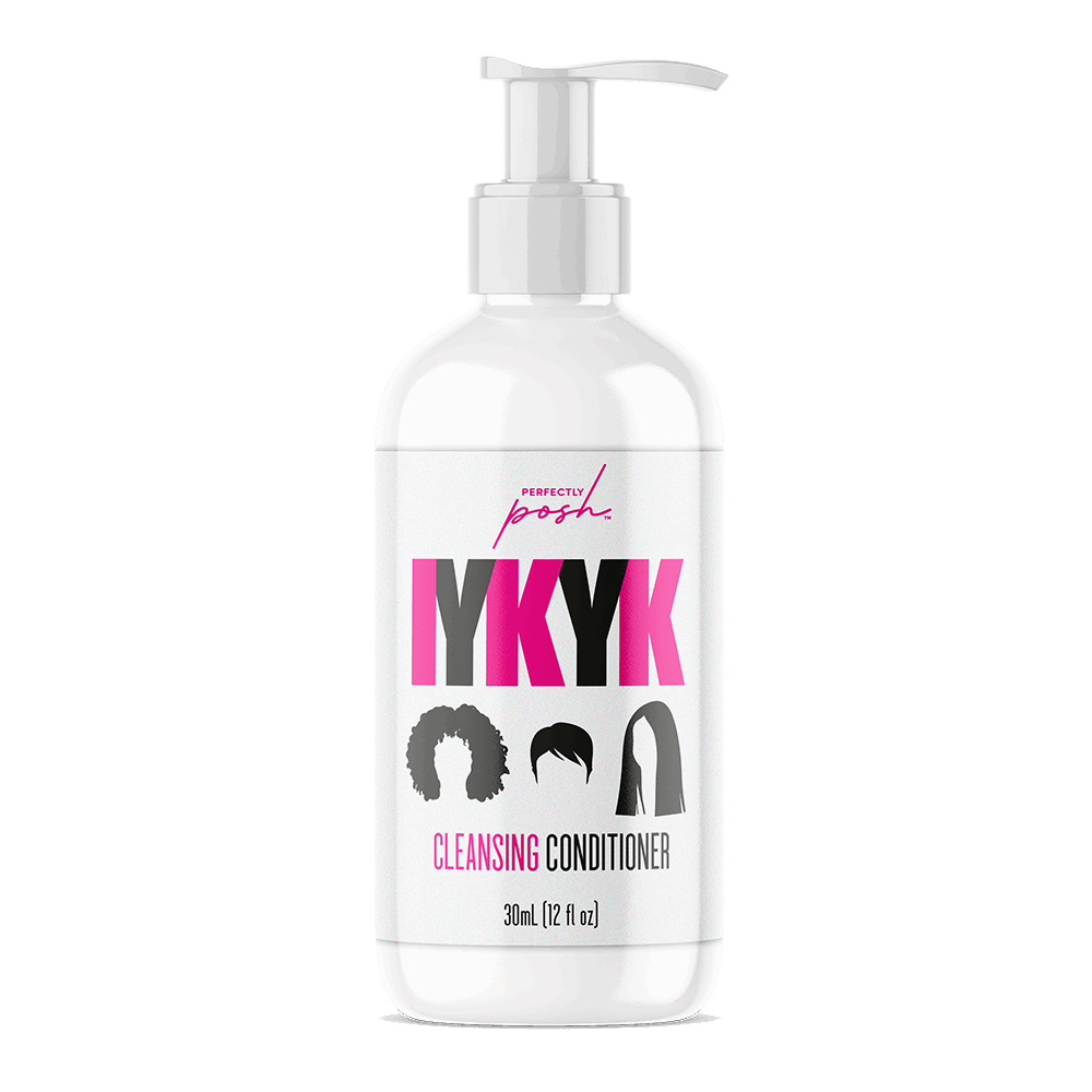 A 12 fl oz (355 ml) white pump bottle of Perfectly Posh IYKYK Cleansing Conditioner, featuring black and pink text and hair type silhouettes, with a no-foam formula for clean, hydrated hair.