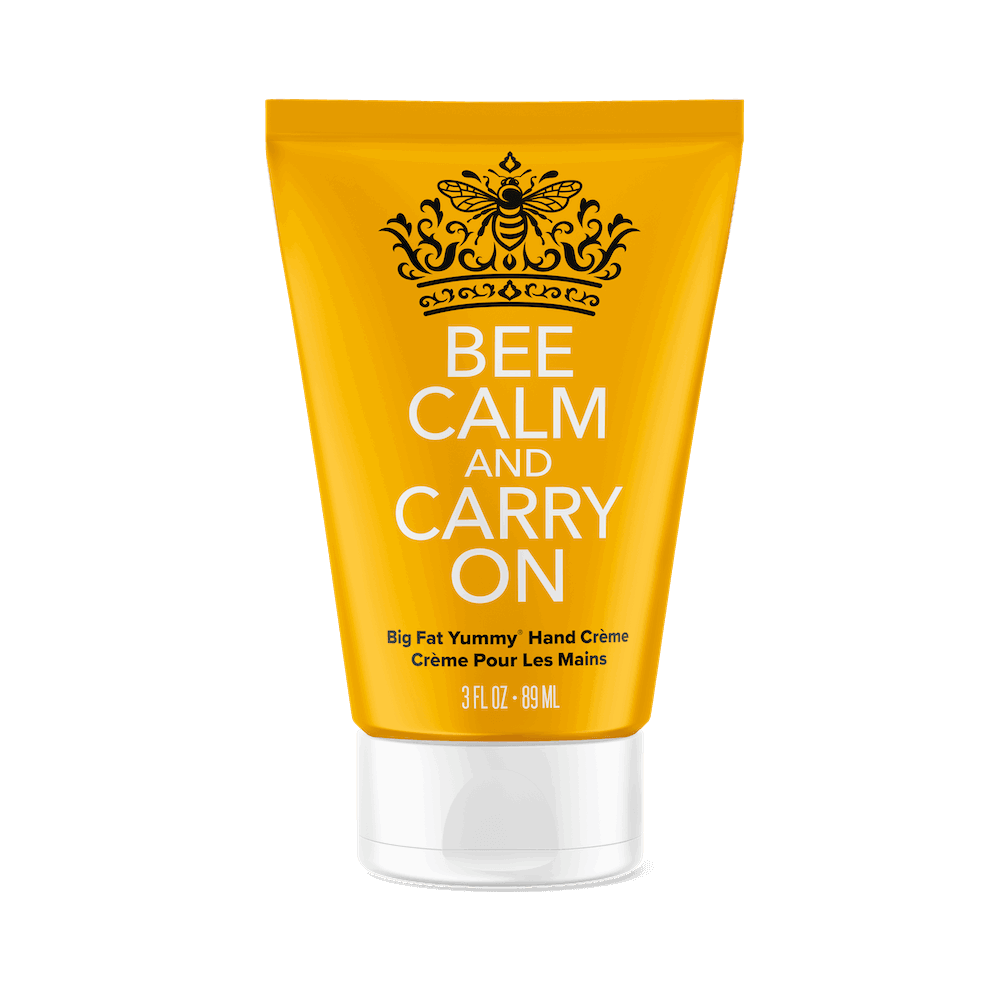 Perfectly Posh’s Bee Calm and Carry On Big Fat Yummy Hand Creme features a yellow tube with a black bee and crown, comes in a 3 fl oz (89 ml) size with a white cap, and offers calming, instant hydration.